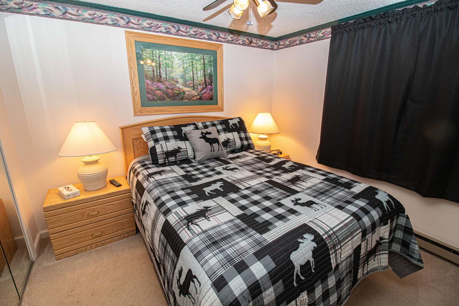 Queen-sized bed in bedroom; Flat Screen TV