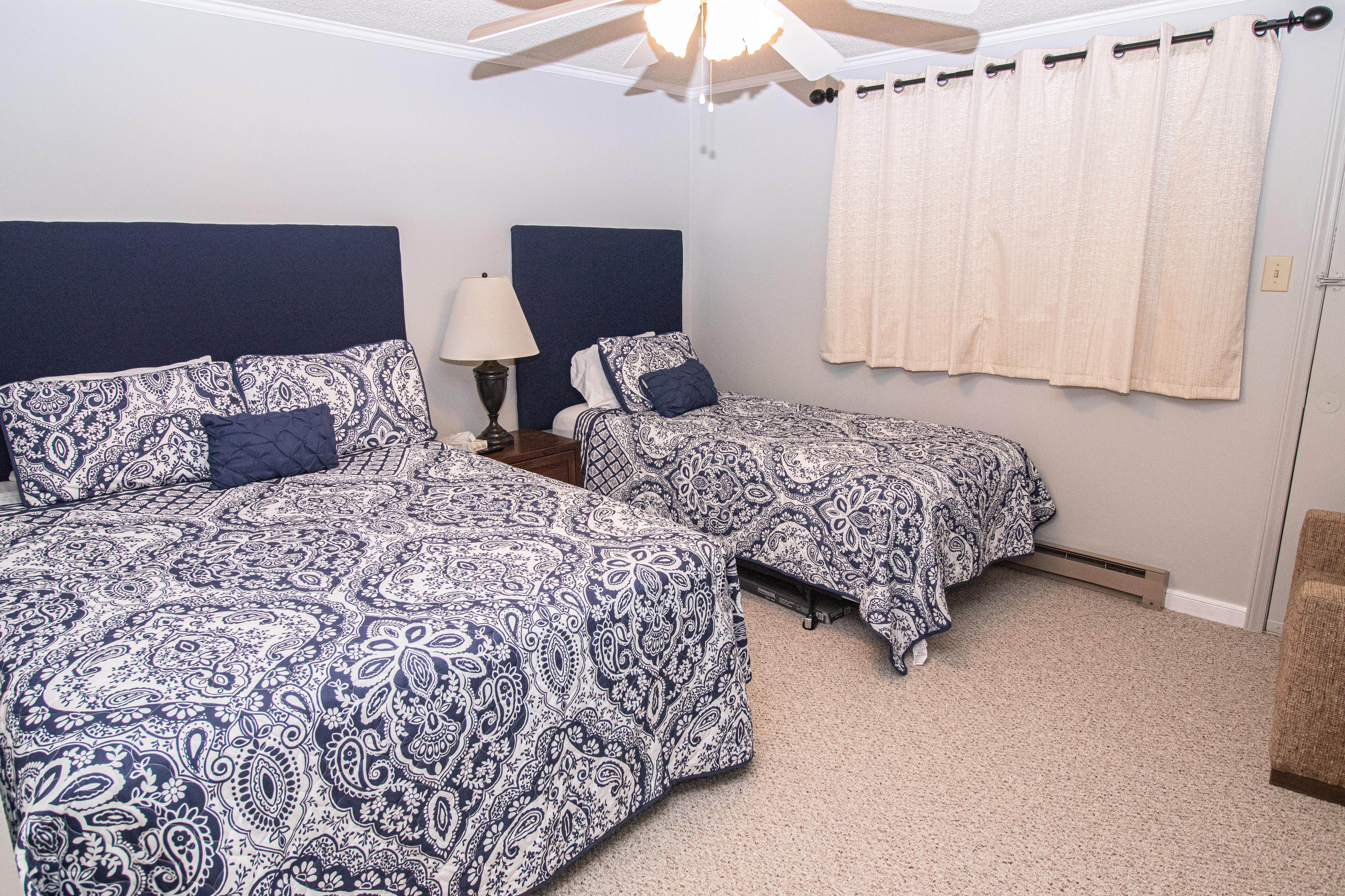 Bedroom 1 includes queen and twin beds