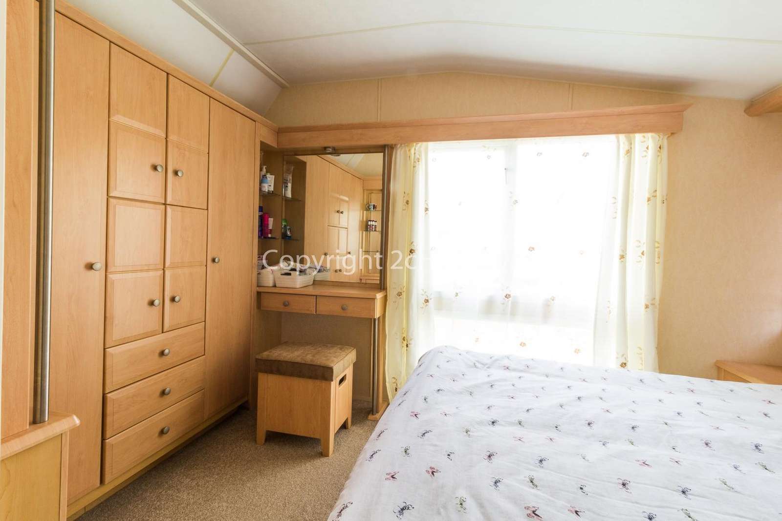 You can find plenty of storage in this master bedroom
