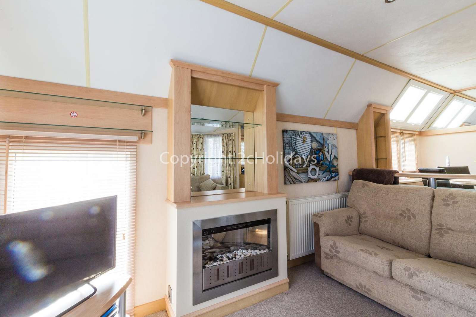 Lovely gas fire giving a homely feel to this caravan