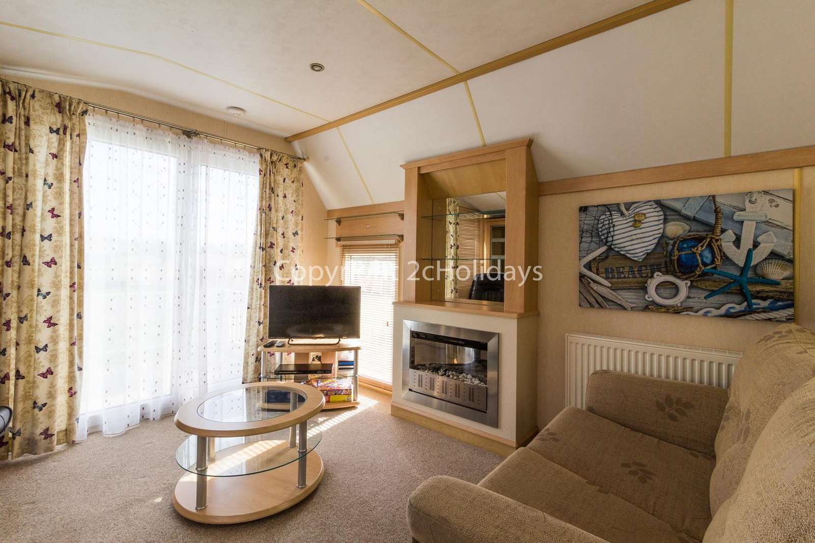 Sliding doors to decking area makes this a perfect holiday home for all!