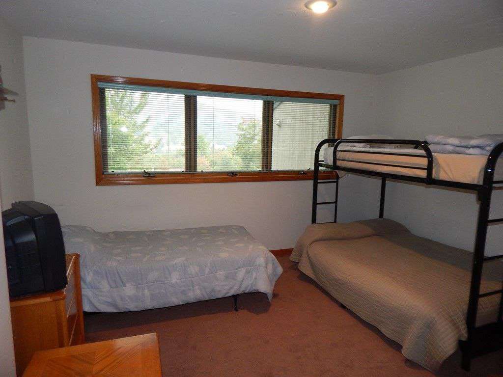 Lower floor bedroom #2 sleeps four, with one twin, one upper twin bunk, and one lower full size bunk.