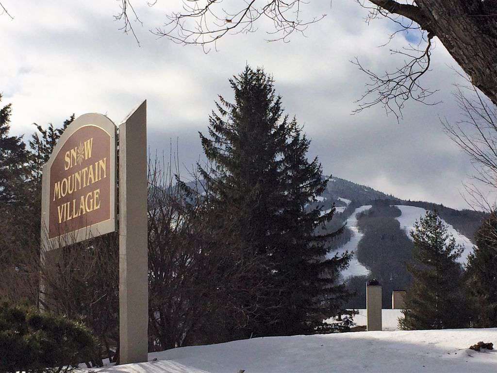 Welcome to Snow Mountain Village in front of Mount Snow