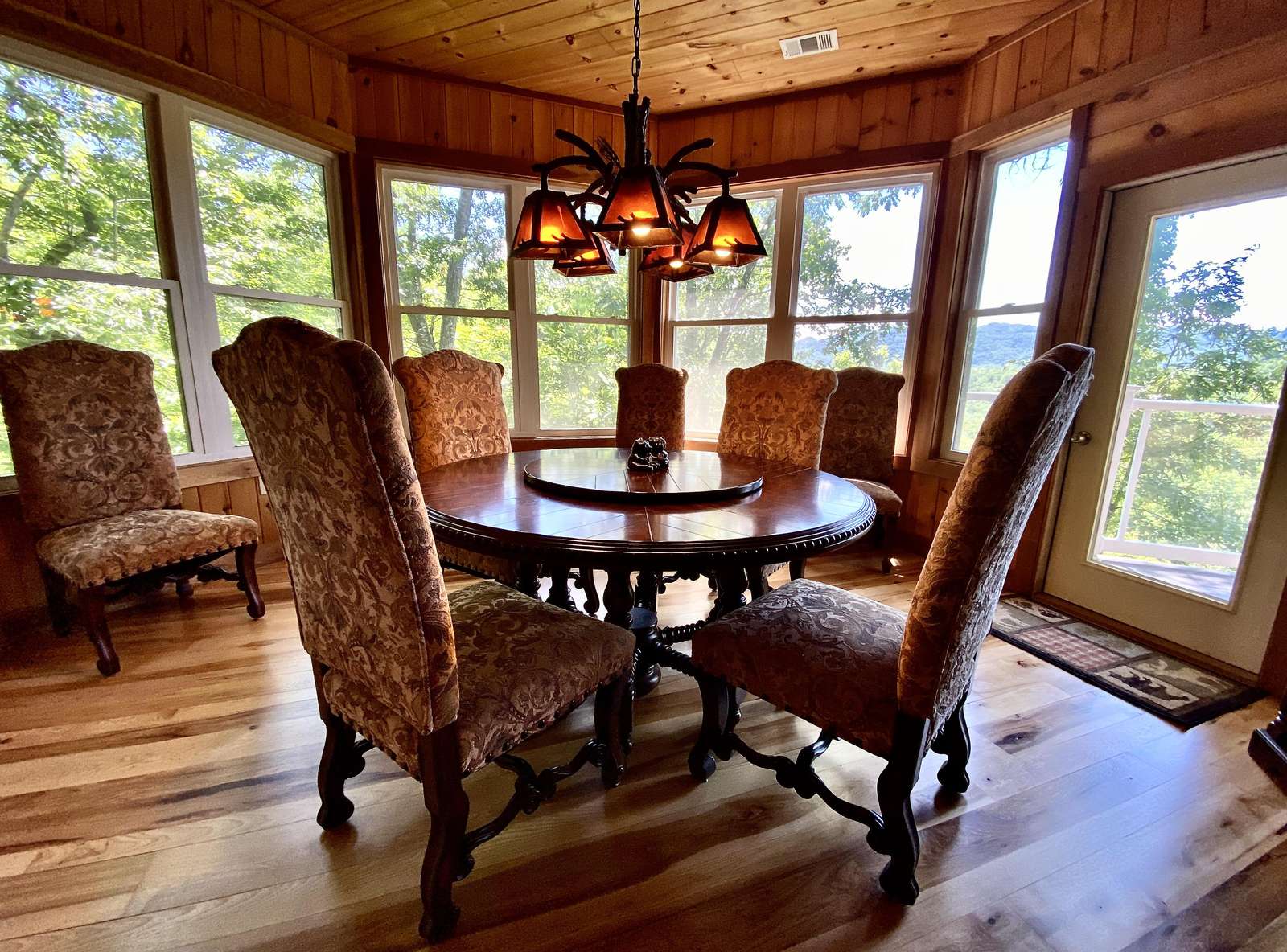 Dining Room offers a "Lazy Susan" Style Table, and opens to the Great Room/Kitchen