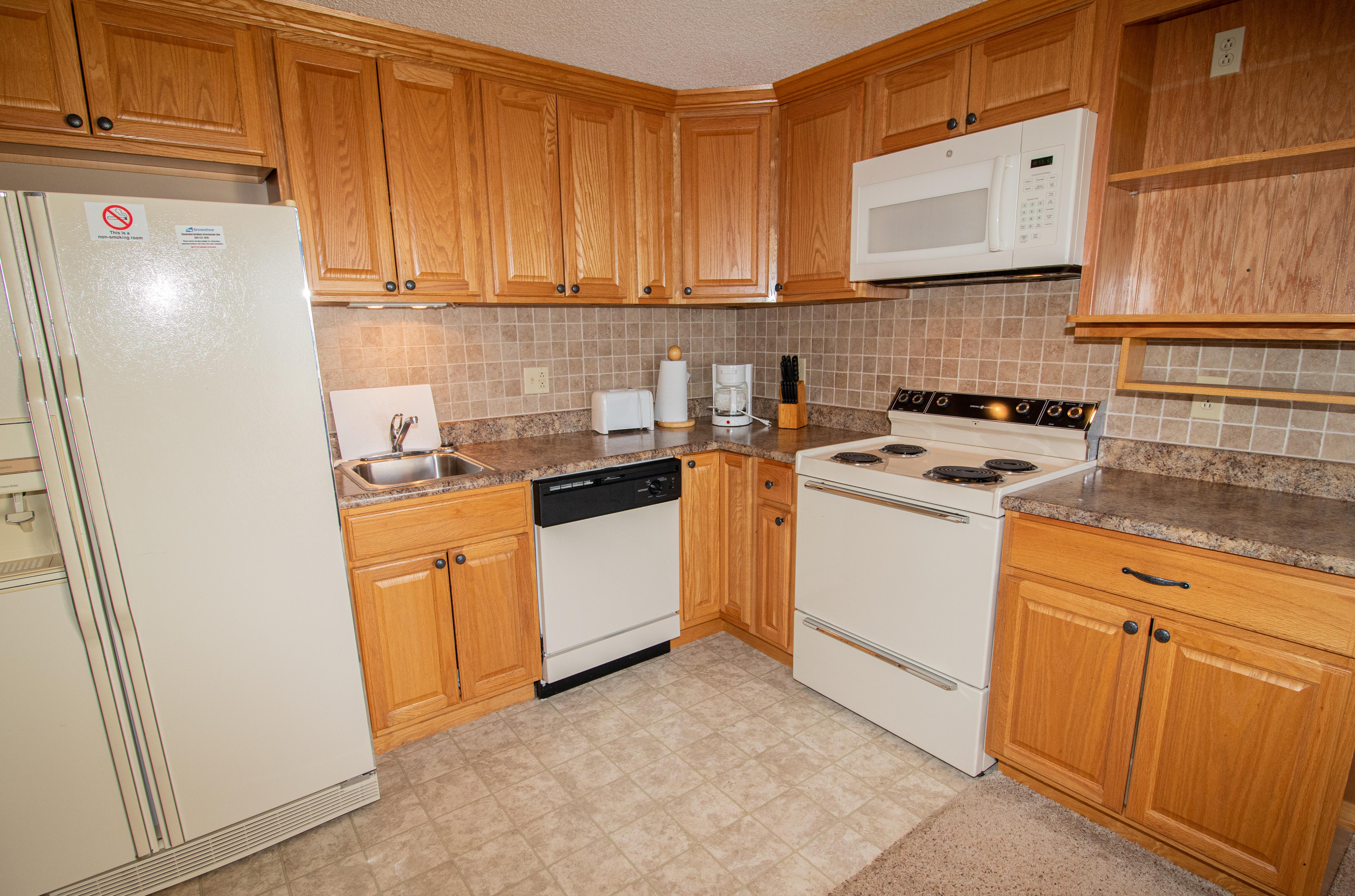 Remodeled kitchen is fully equipped - cook meals in your condo!