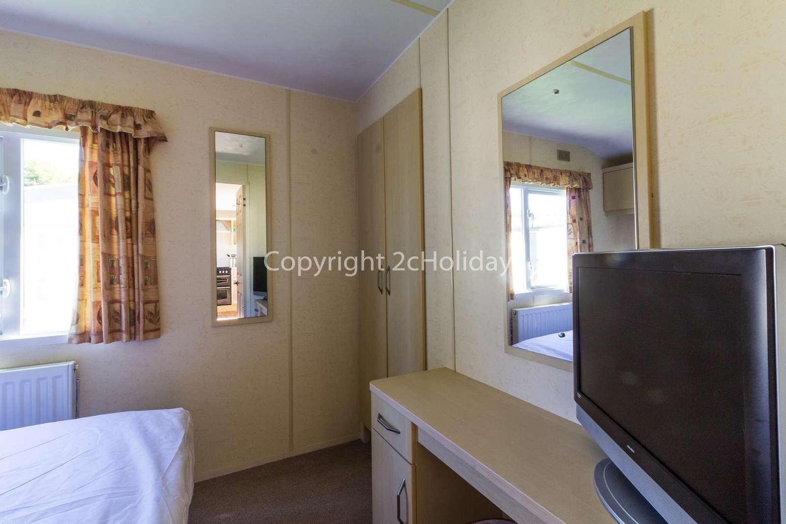 You can find a TV in this master bedroom!