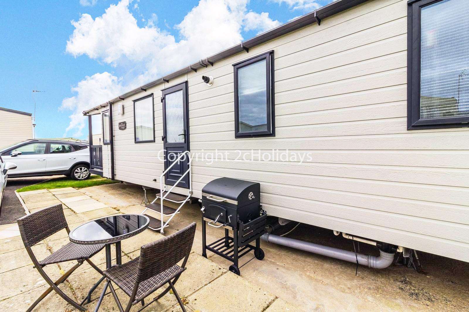 Relax and enjoy the use of outdoor furniture at this mobile home!