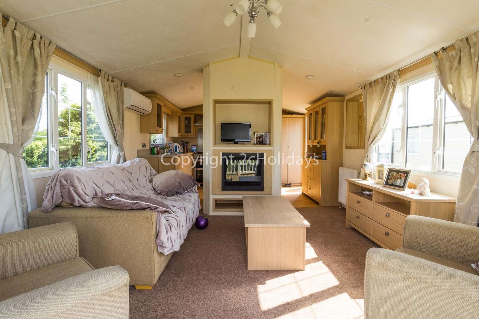 Homely lounge with a TV and electric fire!