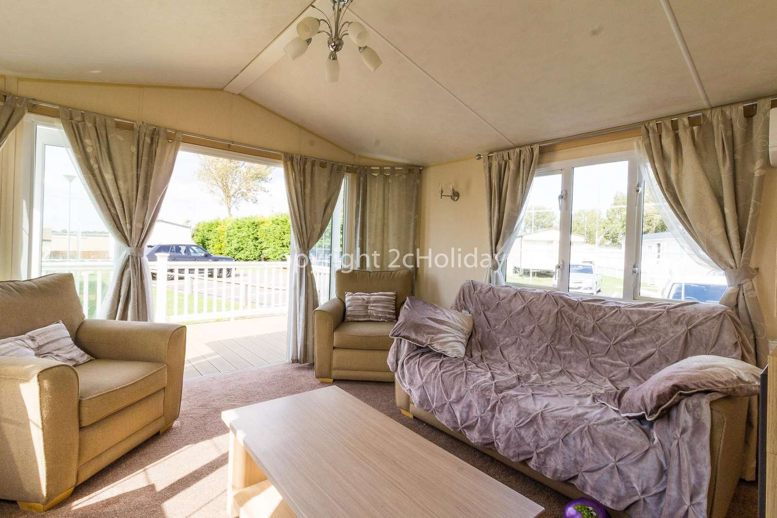 Luxury lounge with double doors leading to the decking area!