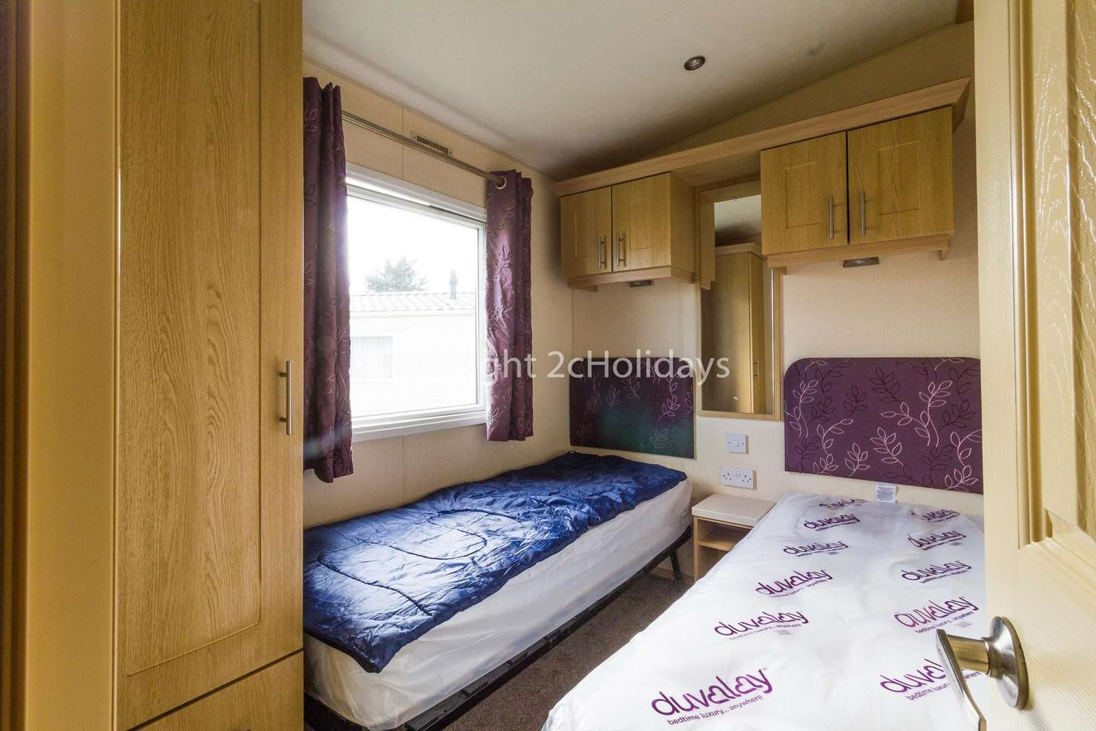 You can find plenty of storage in this twin bedroom