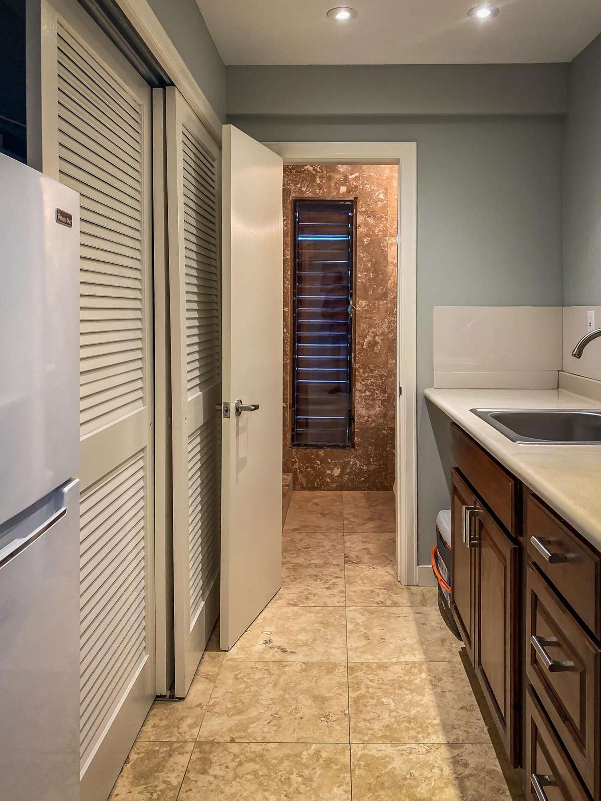 The kitchenette includes a full-size fridge