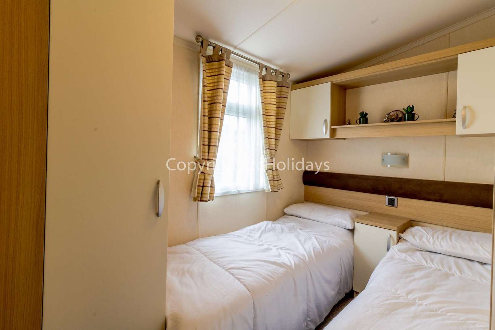 You can find lots of storage space in this twin bedroom