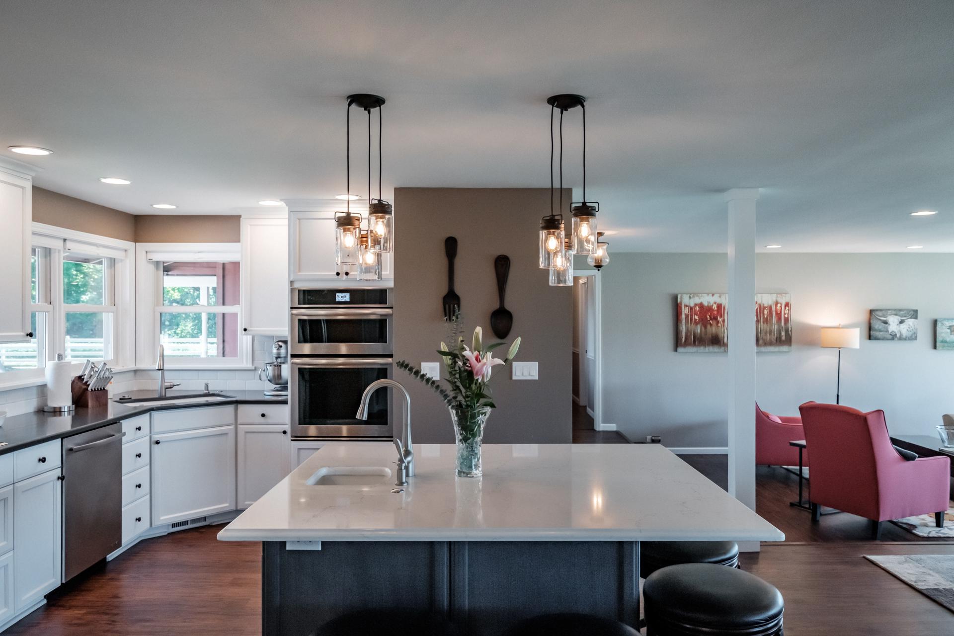 The sunken living room is just steps away from the kitchen bar.