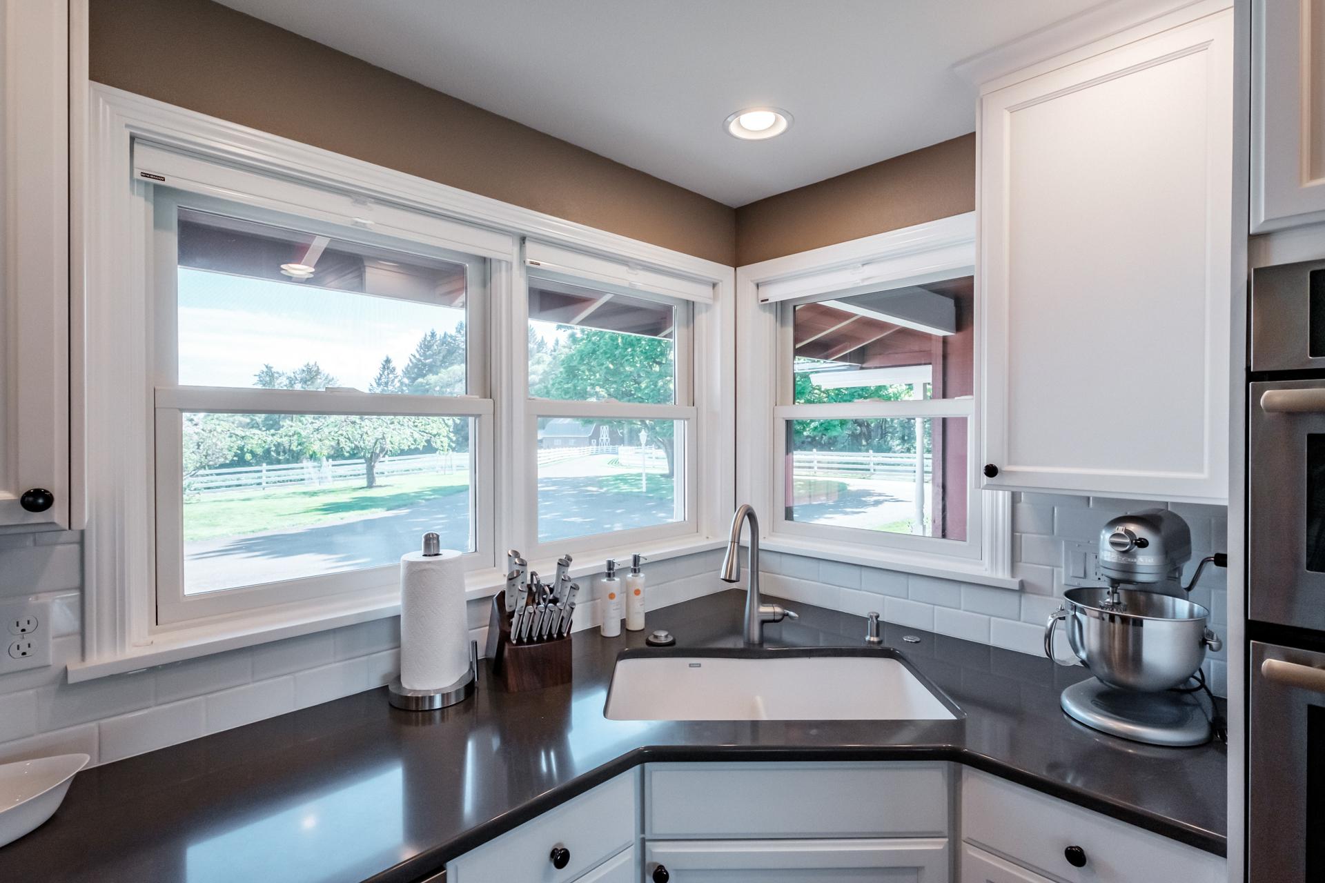 Kitchen sink - Great view of the barn and front of the property.