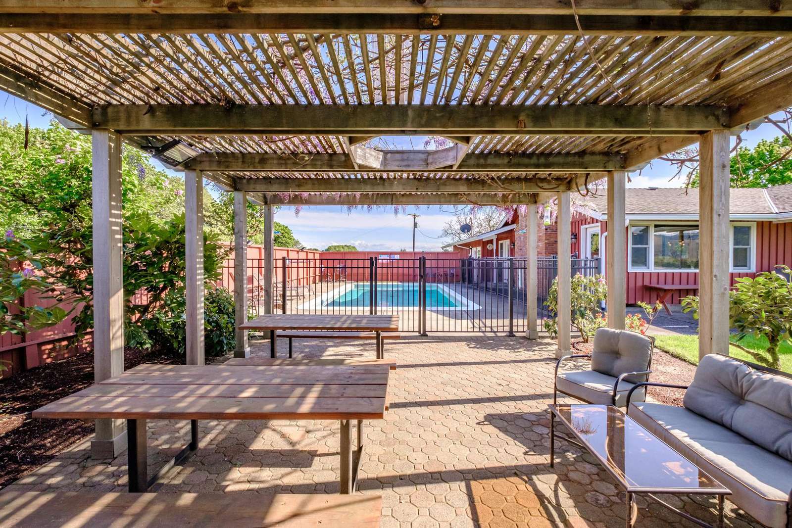 Pergola with seating arranged for family dinner!