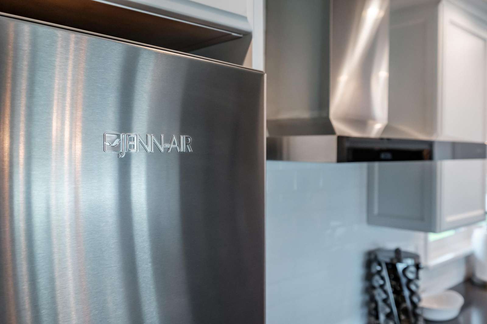 Double-Door refrigerator with lower drawer freezer.