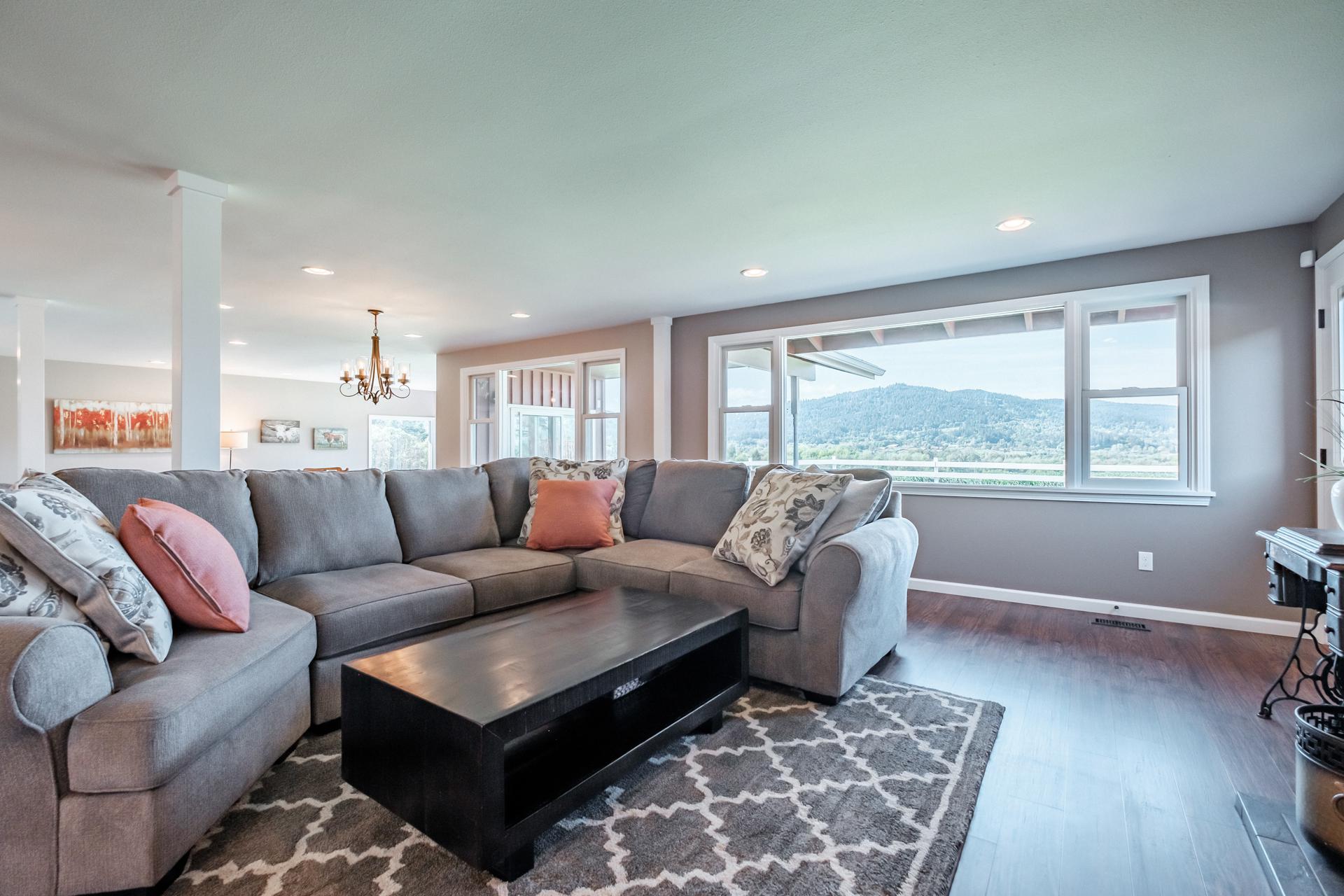 Separate sitting area with sectional couch, fireplace and HDTV.