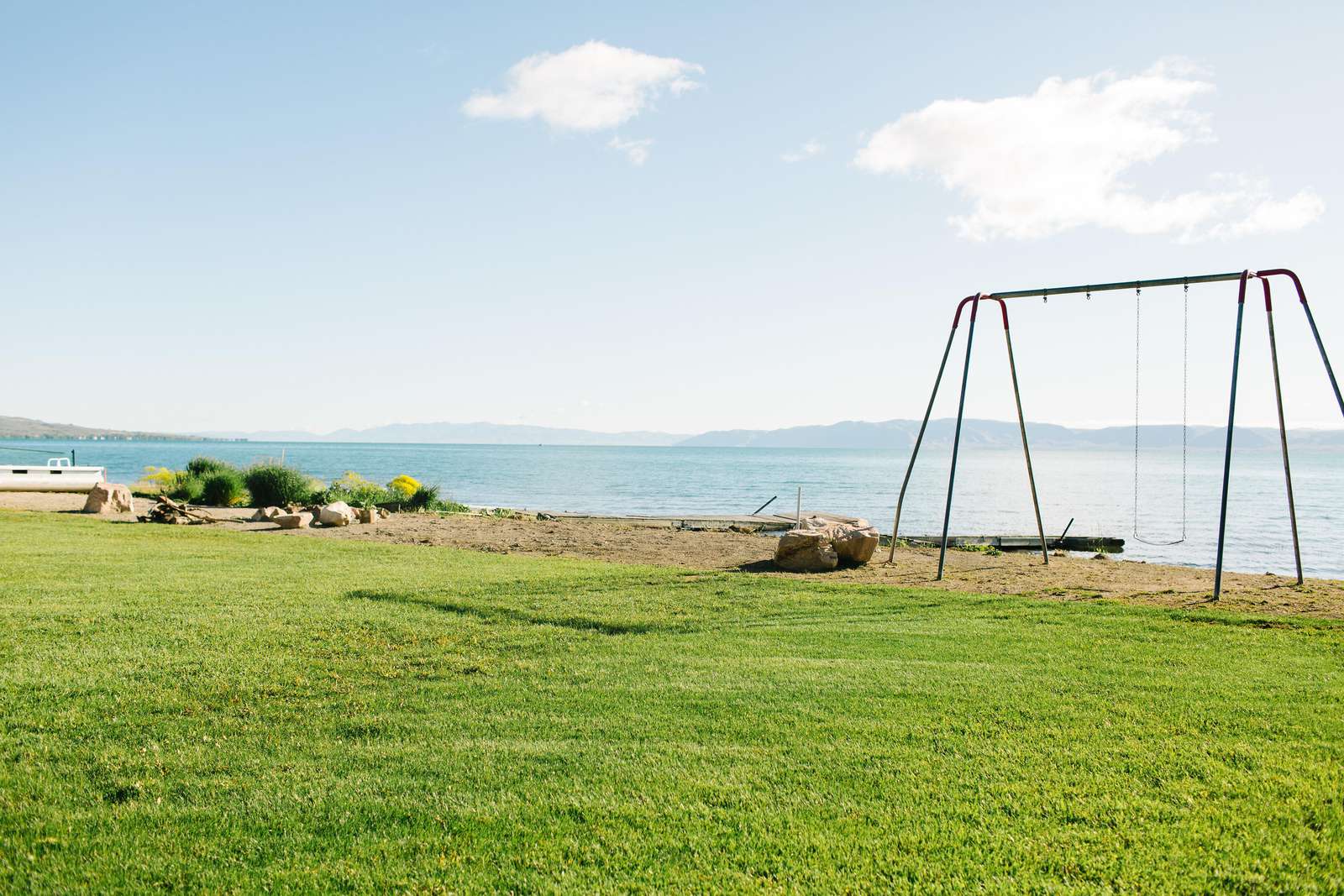 Large grass back yard and beach access