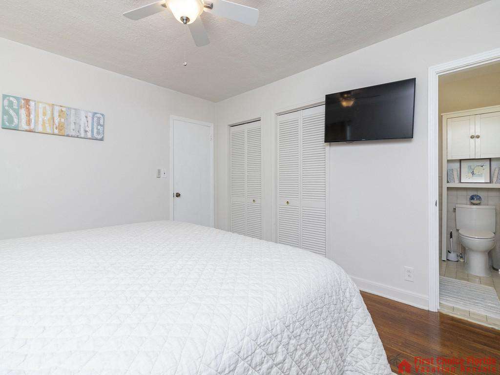 Deja Blue Bed with TV and Bathroom Door