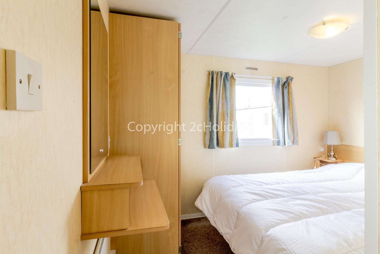 You can find plenty of storage in this master bedroom