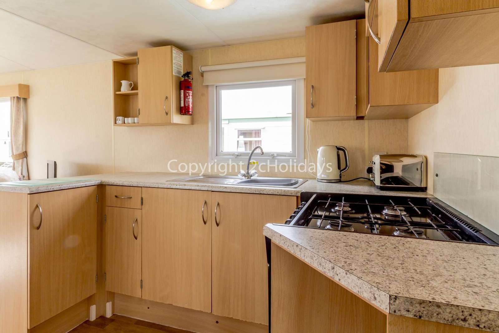 This spacious kitchen includes a full size cooker and fridge/freezer!