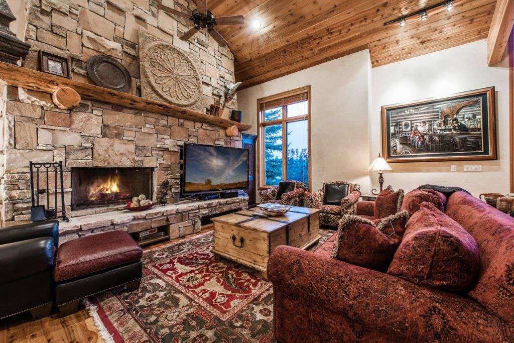 main living room with massive stone fireplace