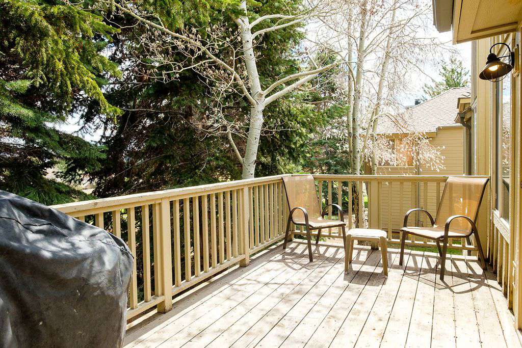 Side view of private deck with lawn chairs