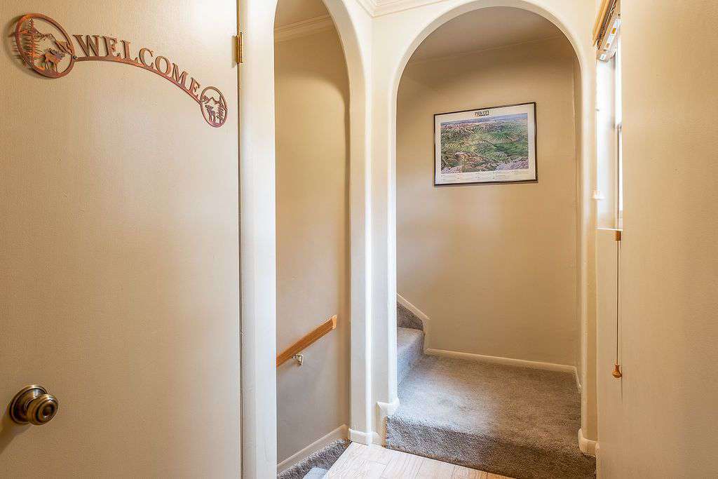 Condo entrance with stairs to first floor and second floor