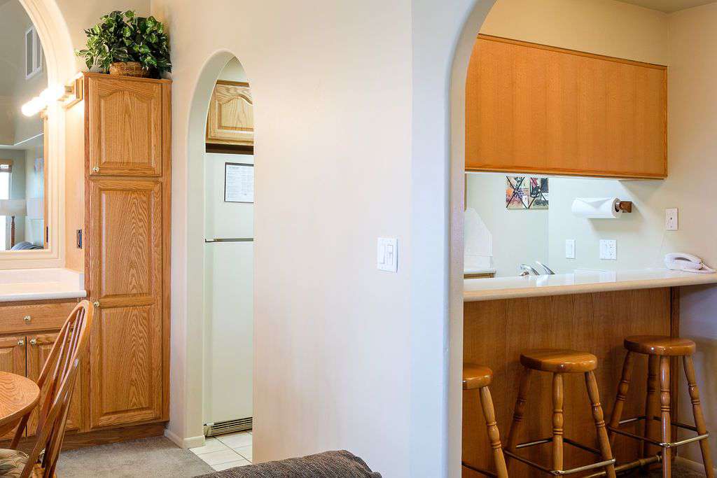 Living room with view of kitchen and breakfast bar