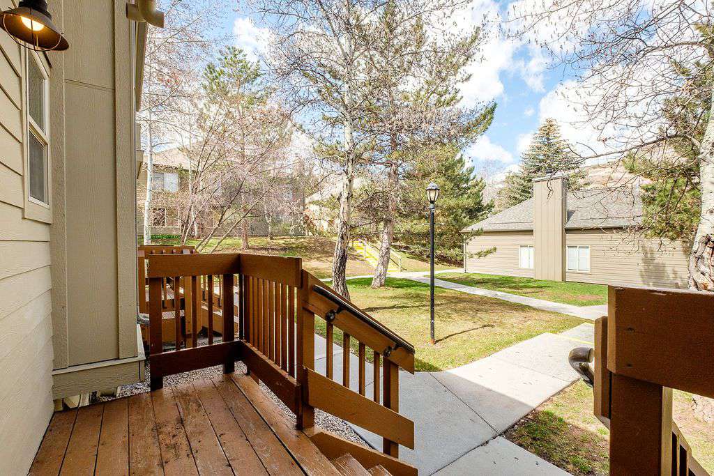 Porch view of walkway leading to condominium
