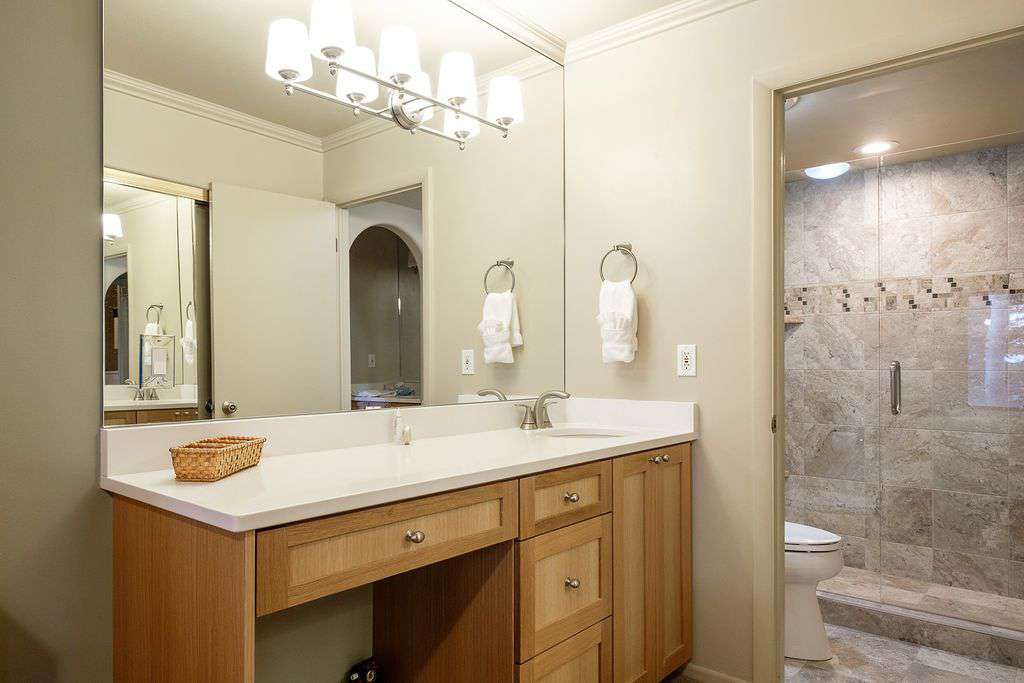First floor master bedroom vanity and private bathroom entrance
