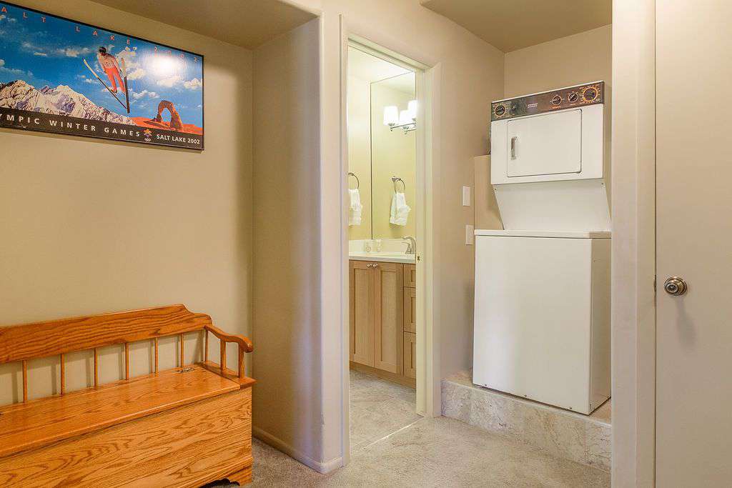 First floor bathroom communal entrance with washer and dryer