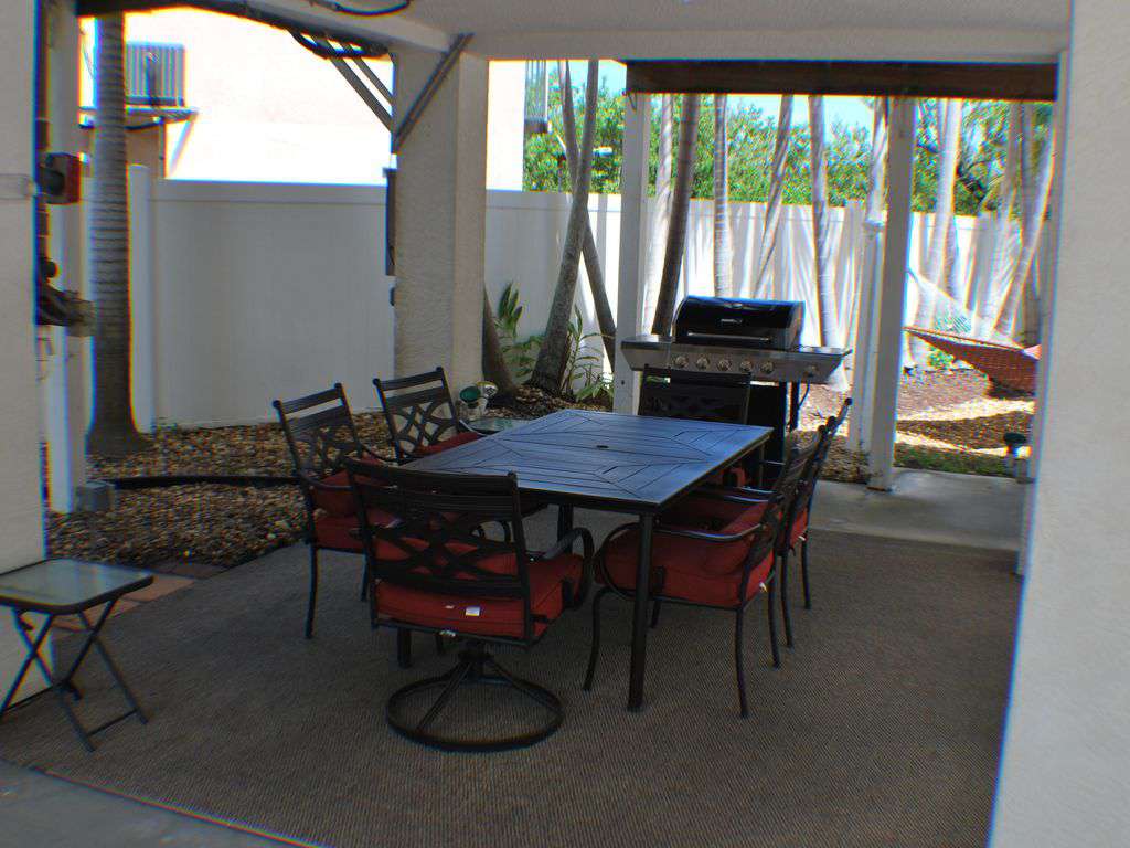 out door patio area with Gas Grill and Patio table. Also a Hammock for relaxing