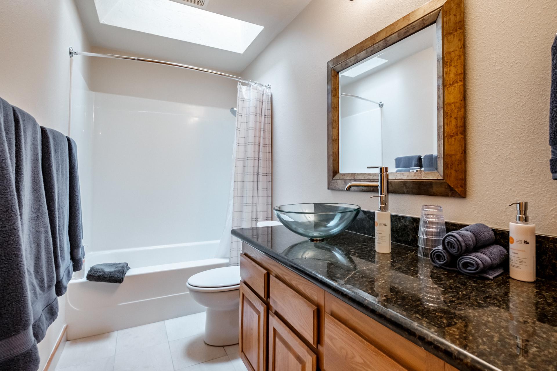 Spacious hall bathroom shared by bedroom 1 and bedroom 2