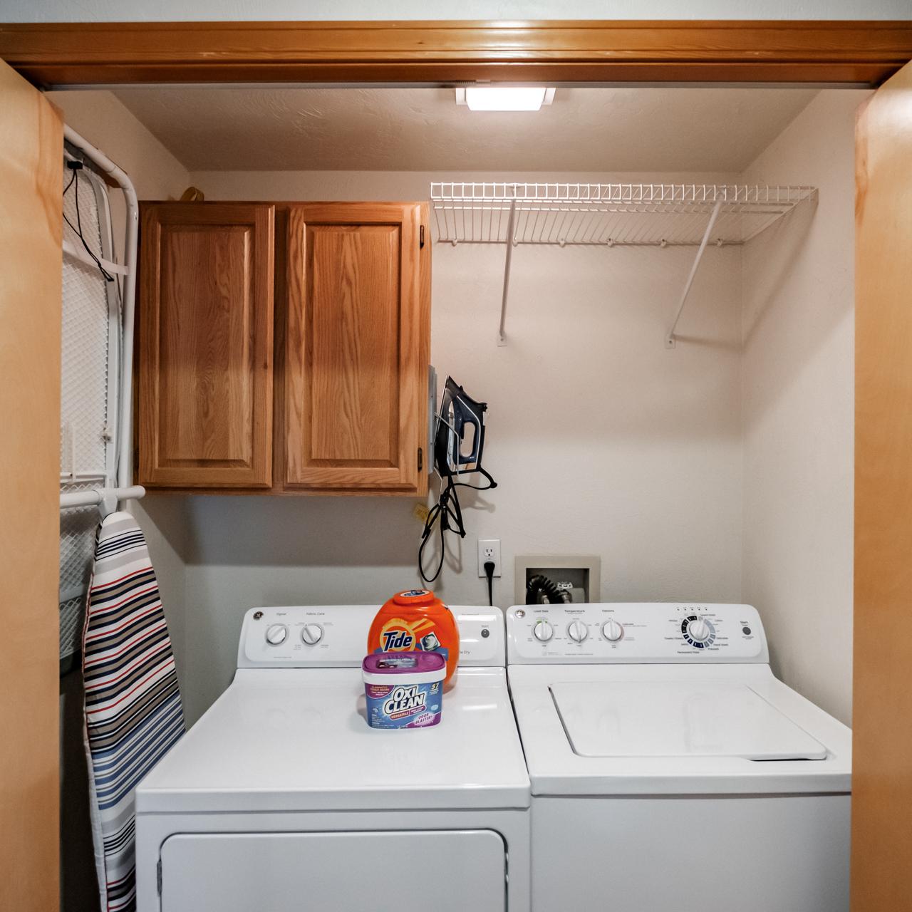 Utility Closet - Ironing board and iron.