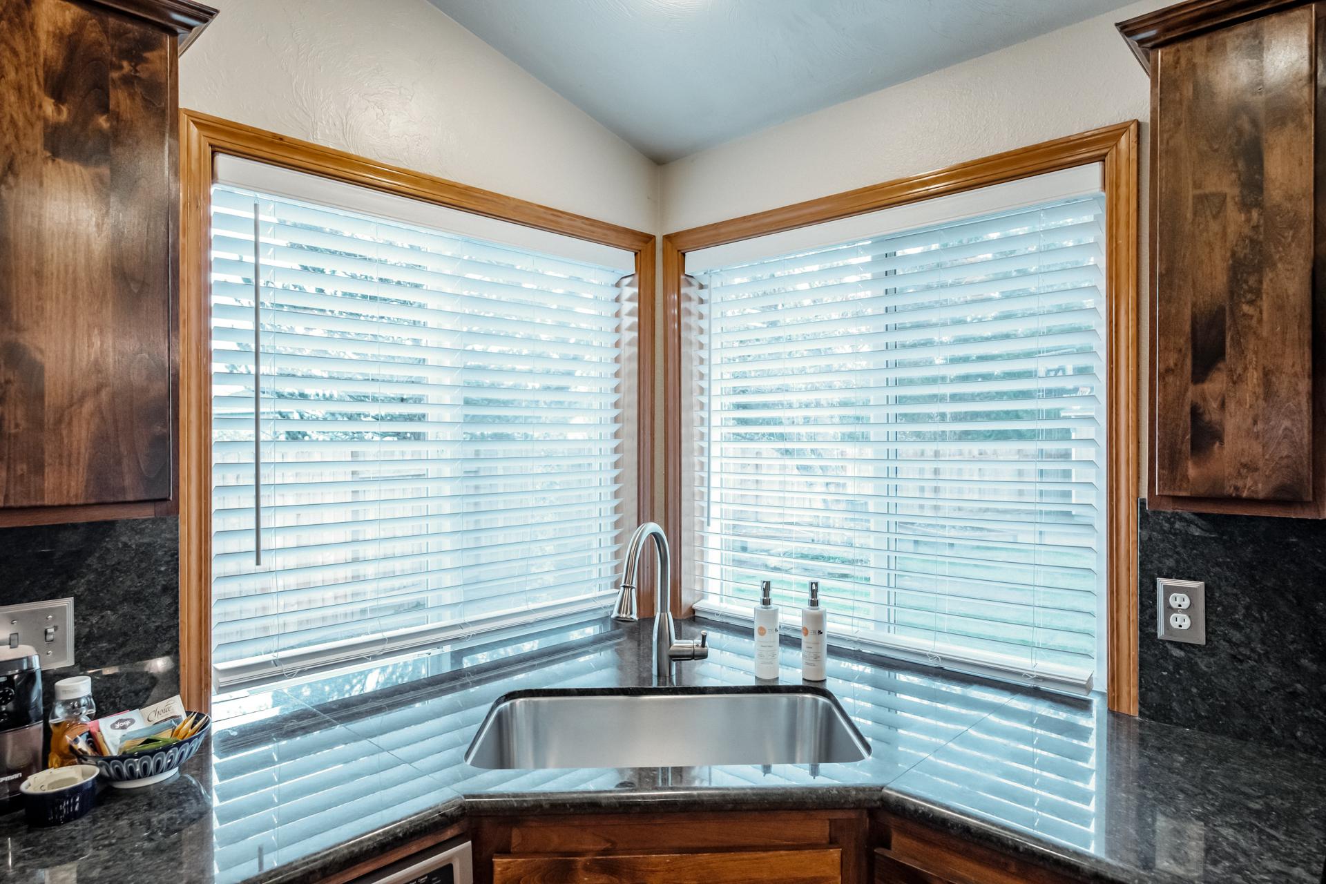 The kitchen sink looks out to the wild flower garden!