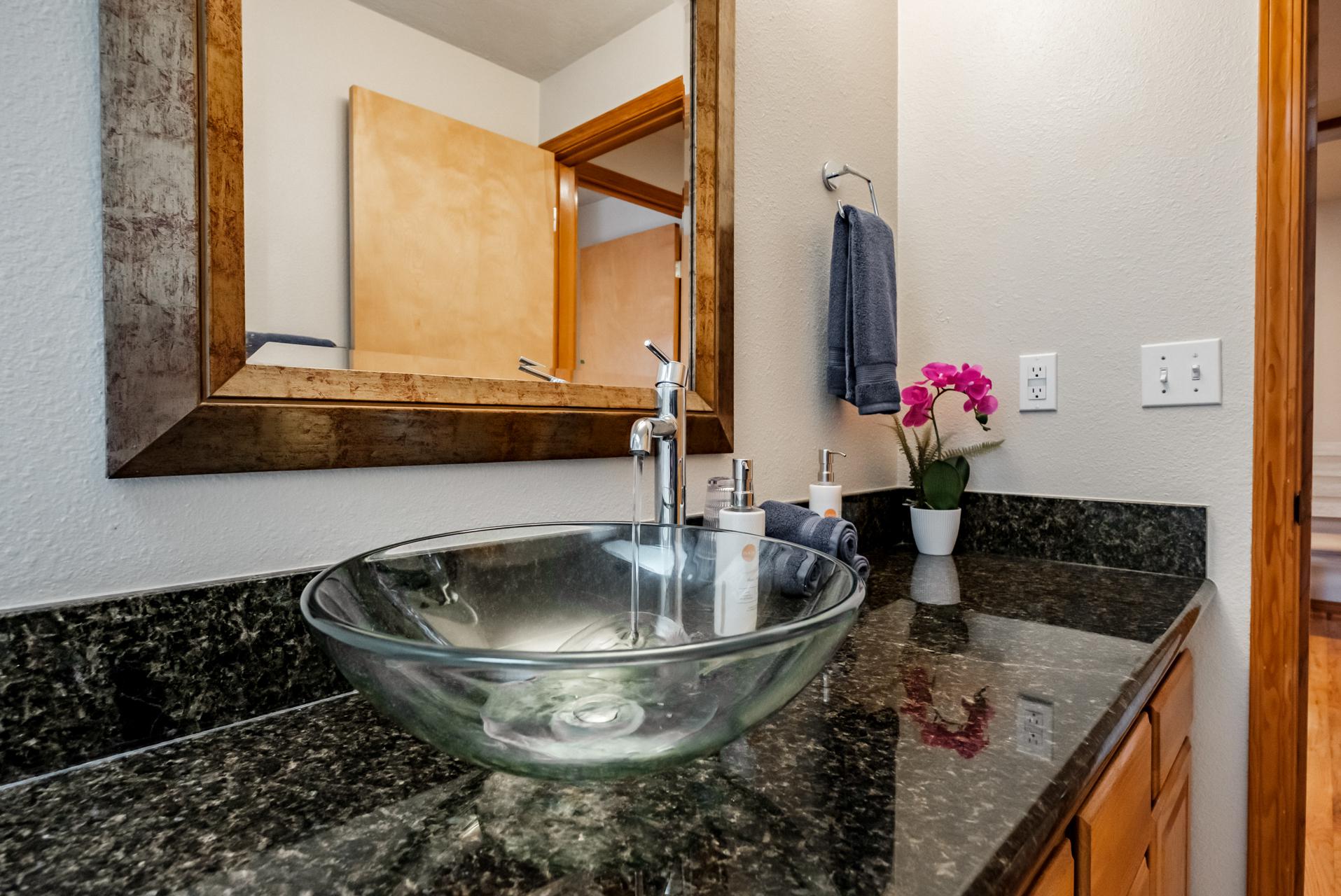 Artful glass sinks in all bathrooms
