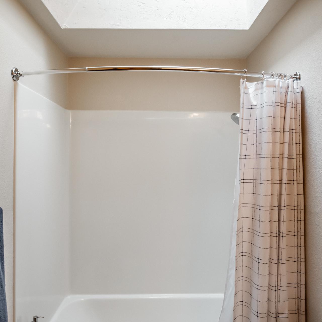 Tub Shower with skylight in the hall bathroom