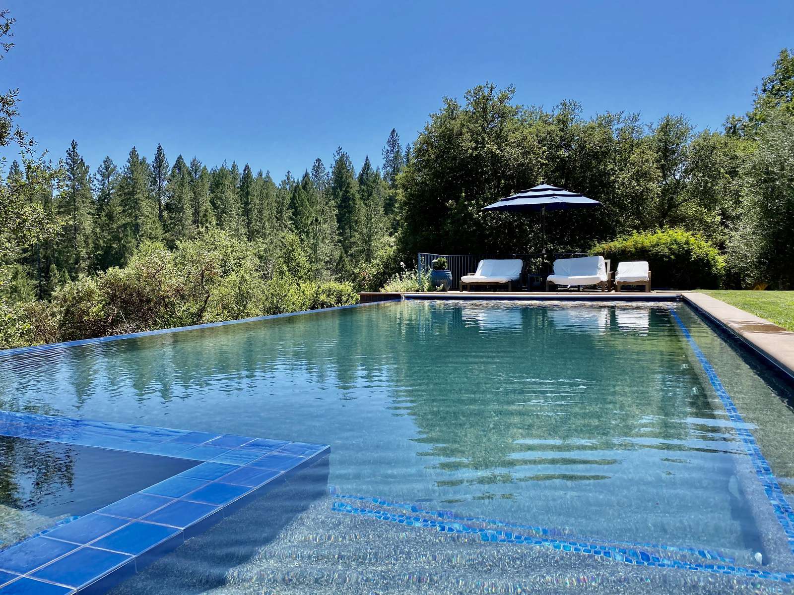 Plenty of shaded and sunny longing on both sides of the large heated pool