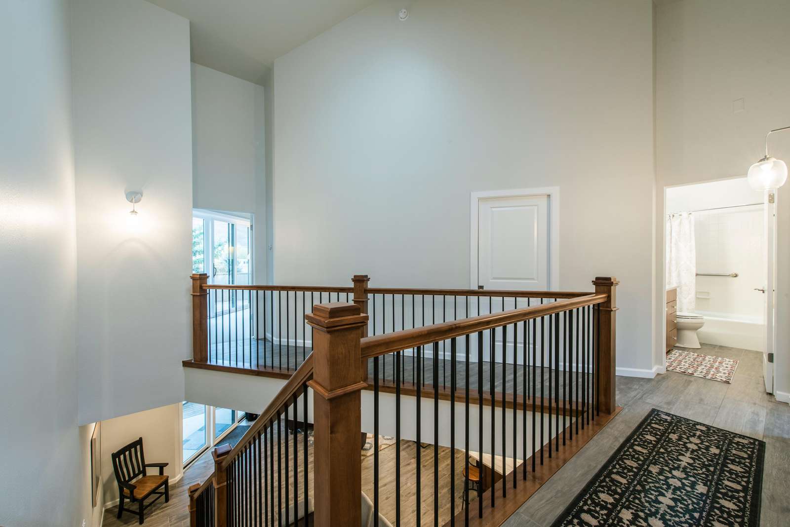 Upper level hallway with vaulted ceiling