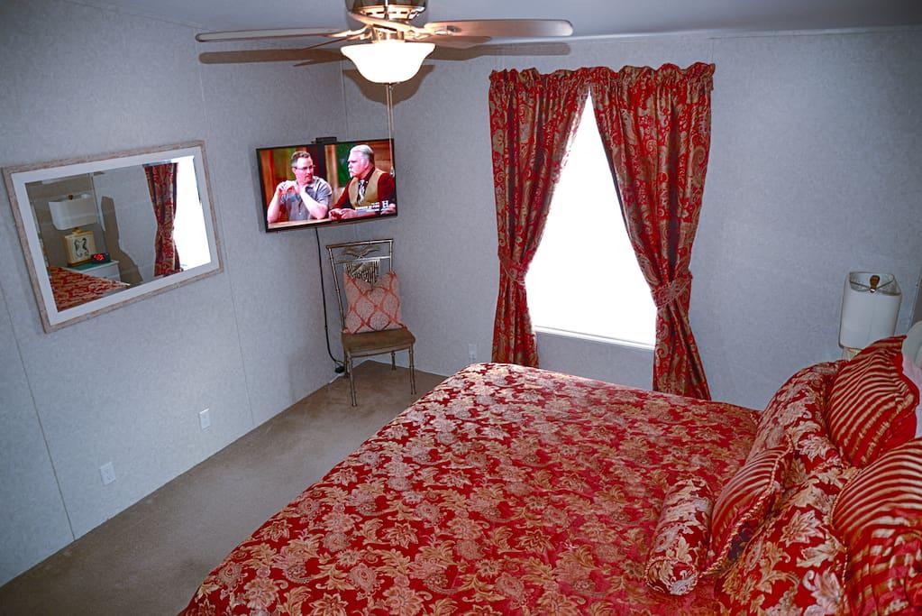 Master Bedroom, King size Bed, Ceiling Fan, Lamps, Alarm Clock, Flat Panel TV, Wow cable and power strips by night stands for phone chargers