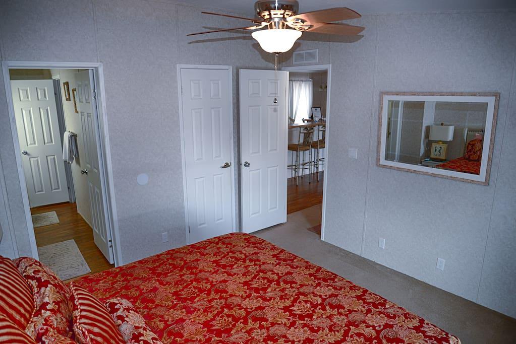 Master Bedroom, King size Bed, Ceiling Fan, Lamps, Alarm Clock, Flat Panel TV, Wow cable and power strips by night stands for phone chargers