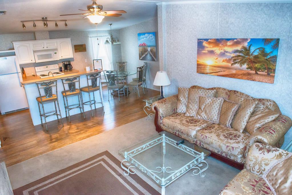 Large Den, Couches, with open space to kitchen and dining room