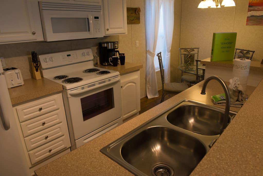 Full Kitchen, Microwave, Oven & Range, Coffee Maker, Toaster, etc.