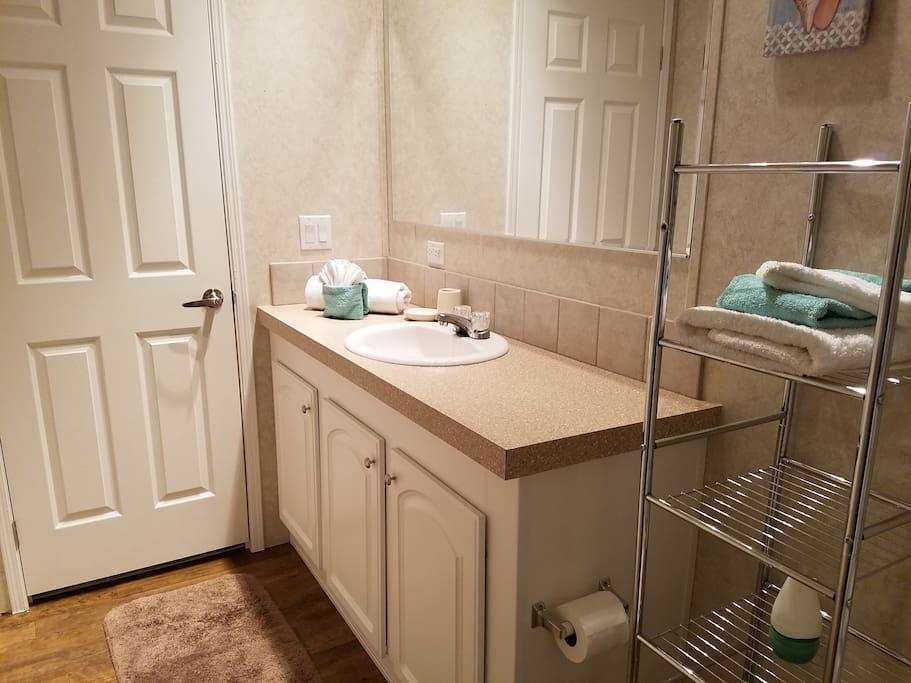 Master Bath w/ towels, hand towels, wash cloths & amenities for guests