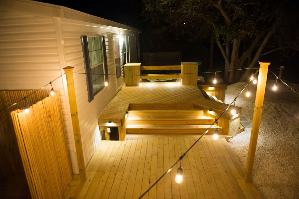Night view of deck with Accent Lighting and String Lighting