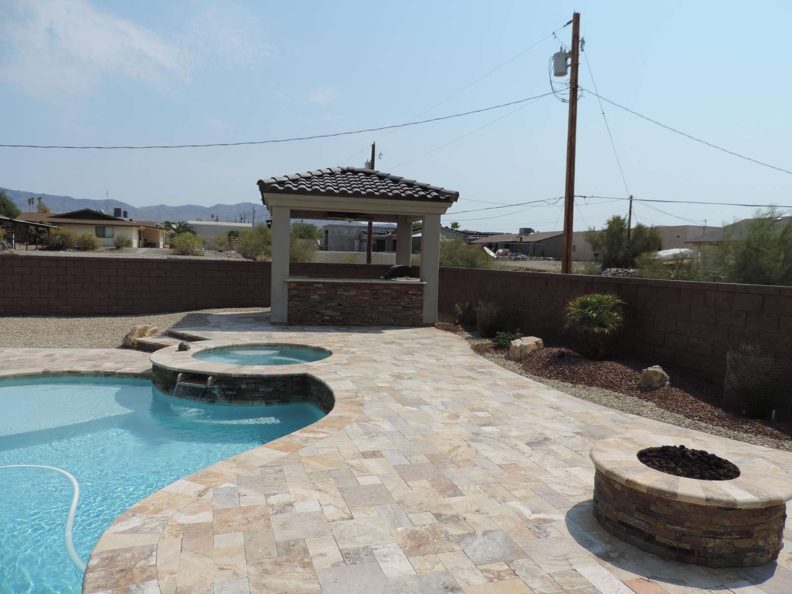 Outdoor kitchen spa and firepit