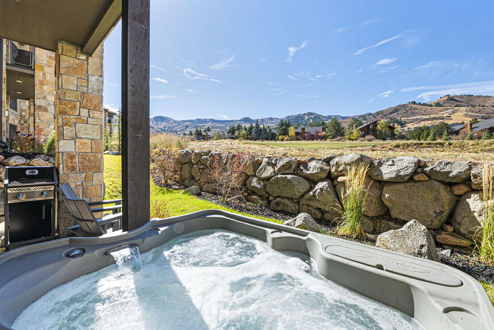 Private hot tub and barbeque grill with mountain views