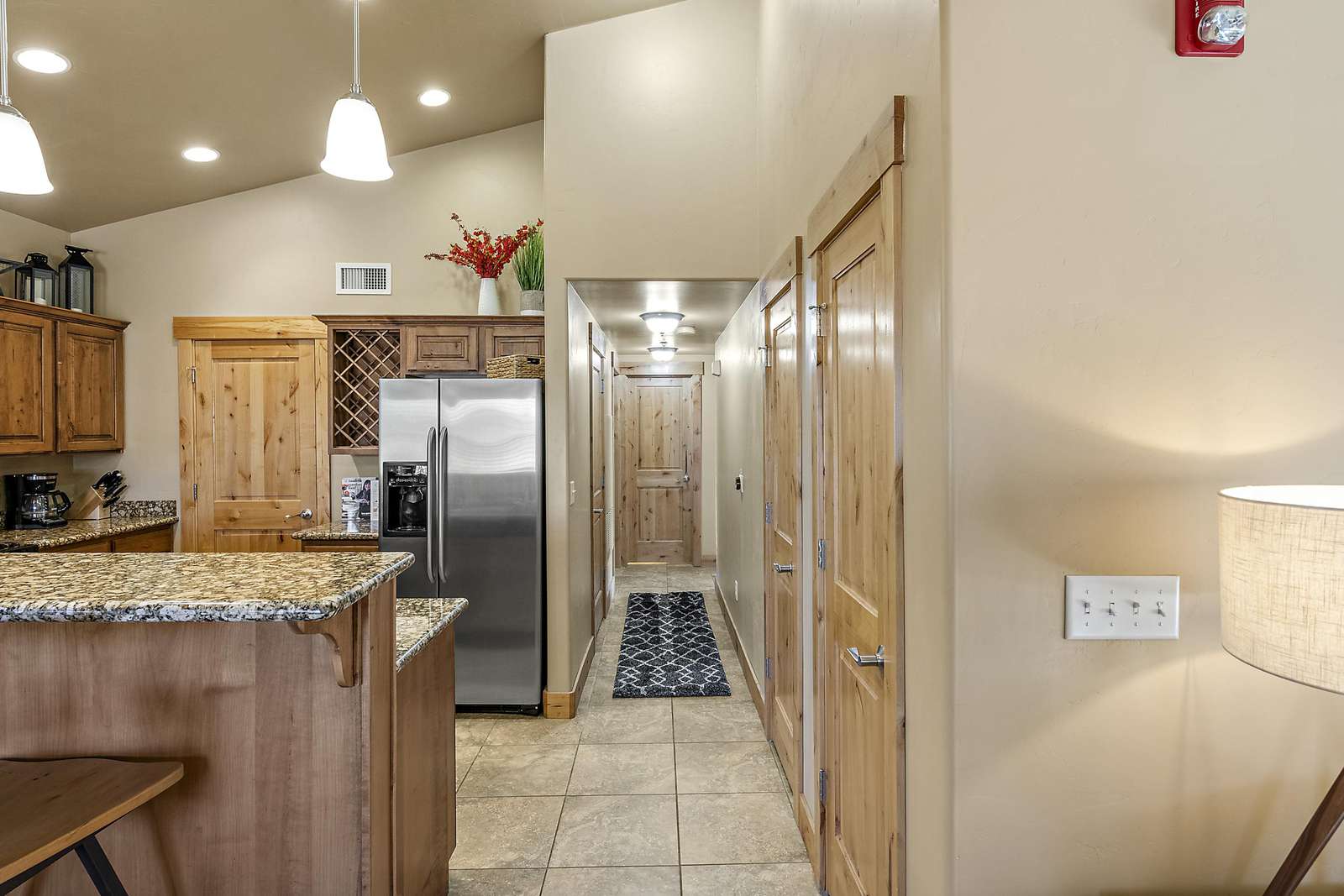 Hallway leading to guest and twin bedrooms with guest bathroom