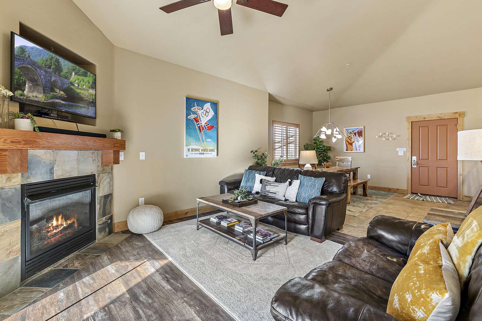 Living room with fireplace and TV